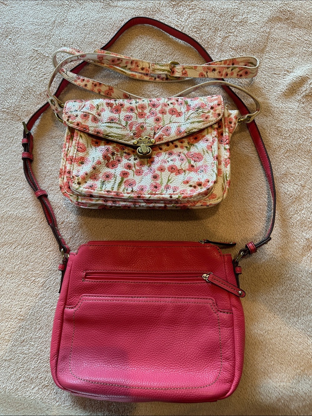 Two Pink Crossbody Bags: one Nica floral and one Tignanello solid pink leather